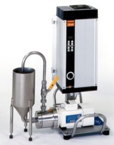 Laboratory machine CD1000 together with a frequenzy converter and it's small reservoir.